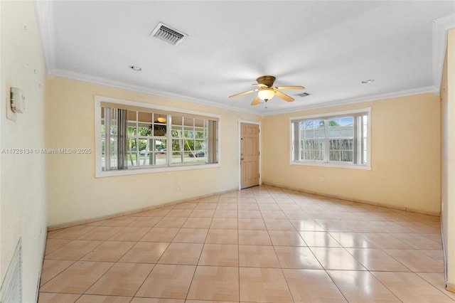 spare room with crown molding and ceiling fan