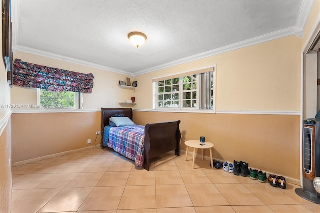 bedroom featuring ornamental molding and a textured ceiling