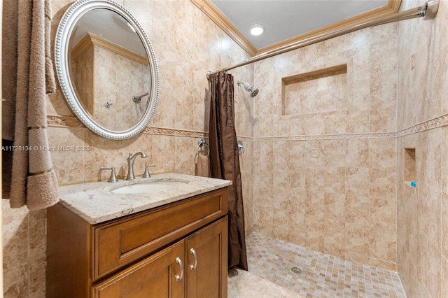 bathroom featuring tile walls, vanity, a shower with curtain, and ornamental molding