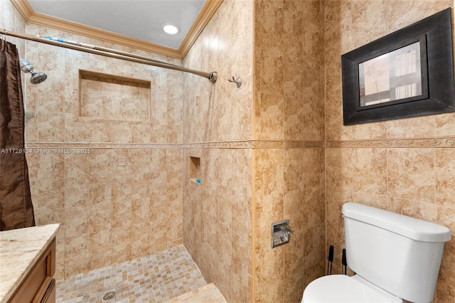 bathroom featuring toilet, crown molding, tile walls, vanity, and curtained shower