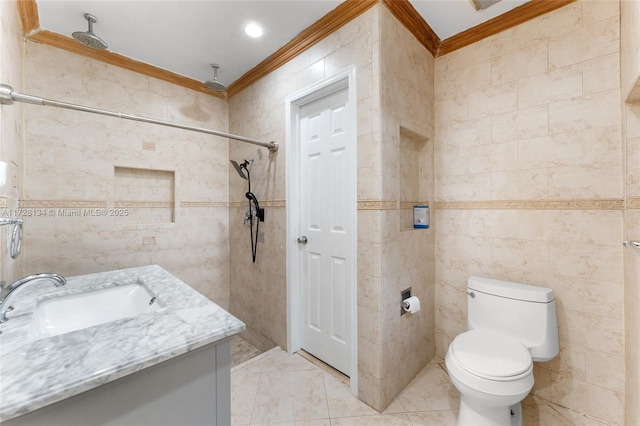 bathroom with a shower, ornamental molding, tile walls, and vanity