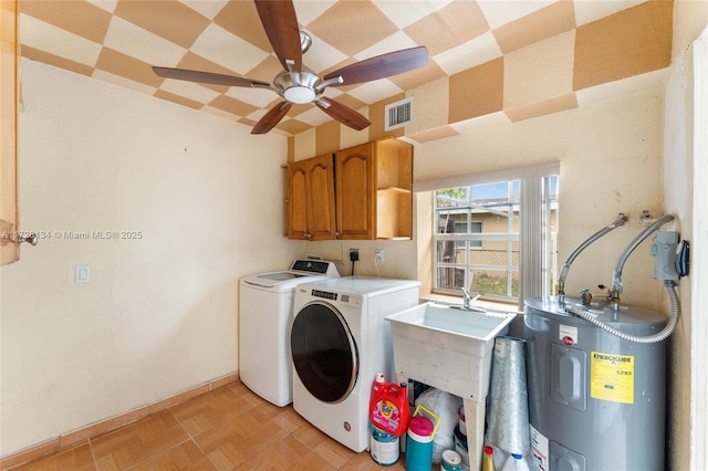 washroom featuring electric water heater, cabinets, independent washer and dryer, and ceiling fan