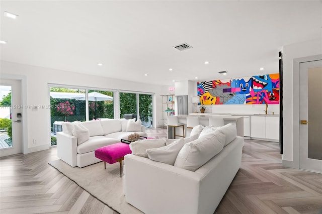 living room featuring light parquet flooring