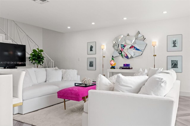 living room featuring light parquet floors