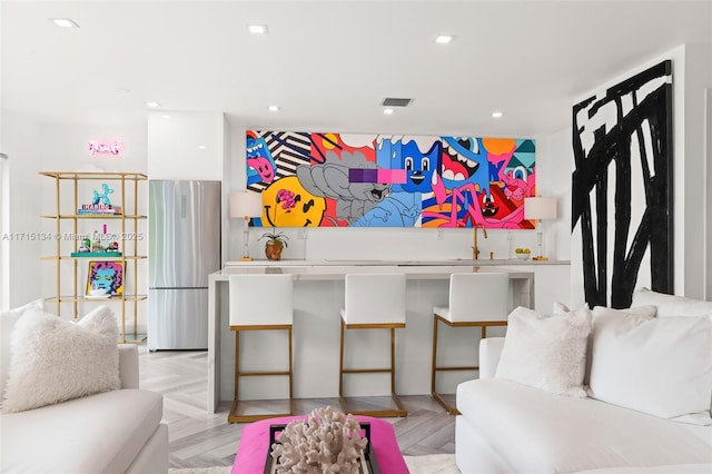 living room featuring sink and light parquet floors