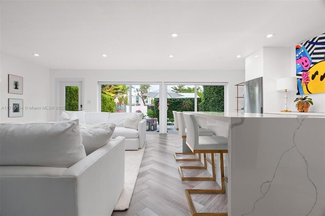 living room featuring light parquet flooring