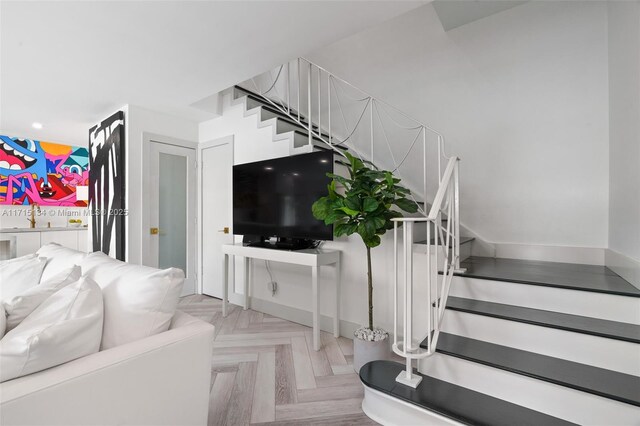 living room featuring light parquet flooring