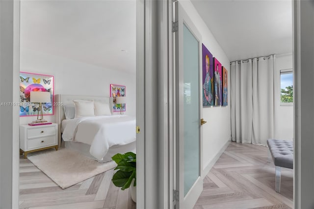 bedroom with light parquet floors
