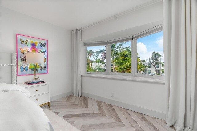 bedroom featuring light parquet floors
