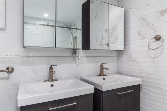 bathroom featuring vanity and decorative backsplash