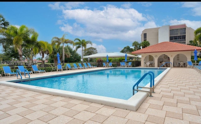 view of swimming pool featuring a patio