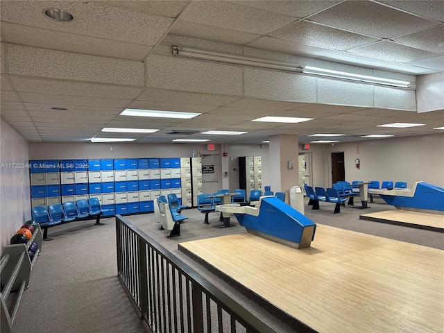 game room featuring carpet flooring and a paneled ceiling