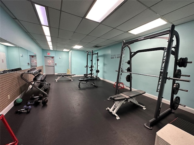 exercise room with a drop ceiling