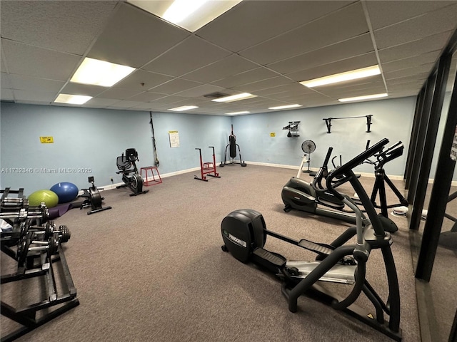 workout area featuring a paneled ceiling