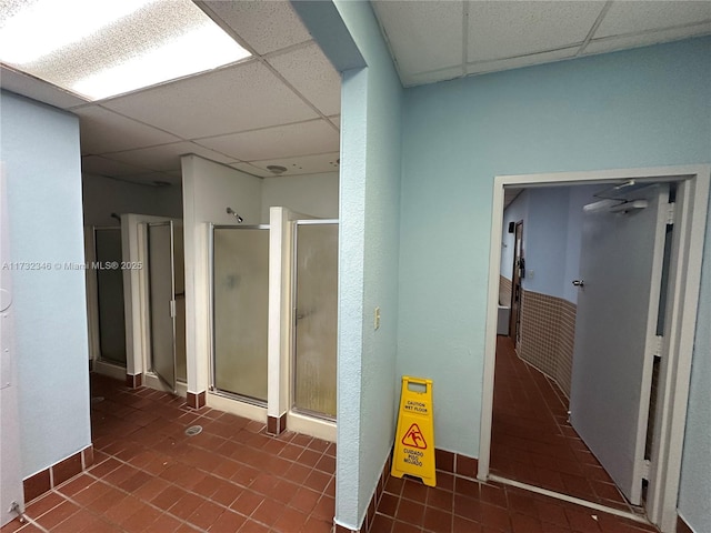 bathroom featuring a drop ceiling