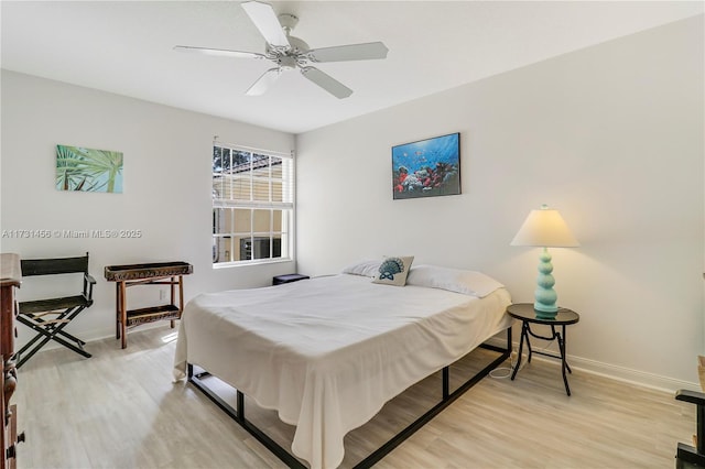 bedroom with ceiling fan and light wood-type flooring