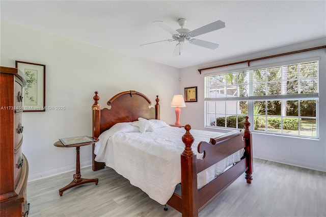 bedroom featuring ceiling fan and light hardwood / wood-style flooring