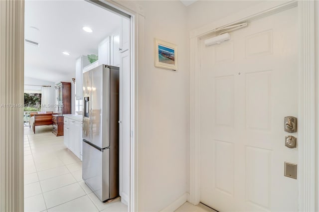 hallway with light tile patterned flooring