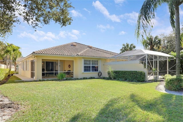 back of property featuring a yard and a lanai