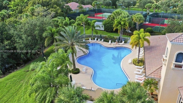 view of swimming pool with a patio