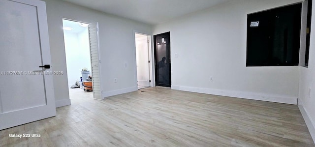 unfurnished bedroom with light wood-type flooring