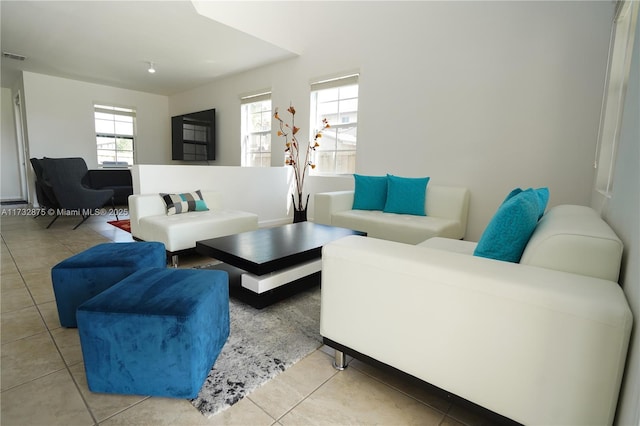 living area with light tile patterned floors