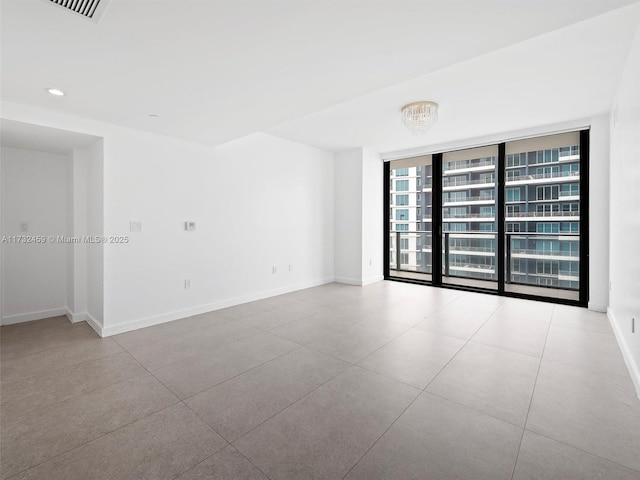 empty room featuring floor to ceiling windows