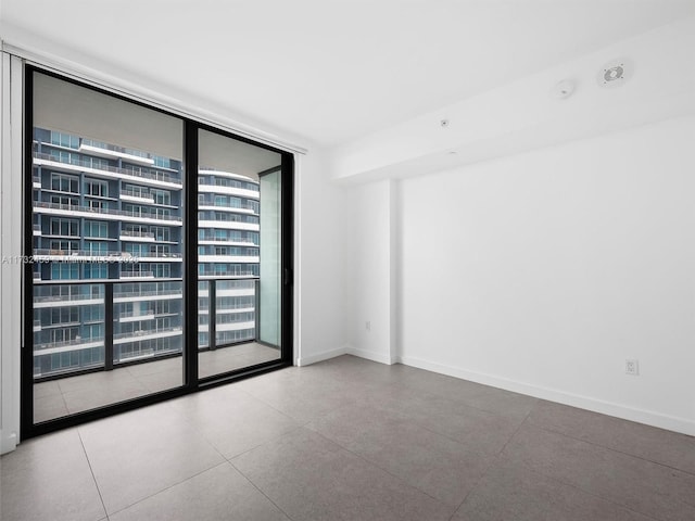 spare room featuring expansive windows