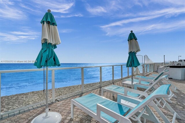 view of patio featuring a water view