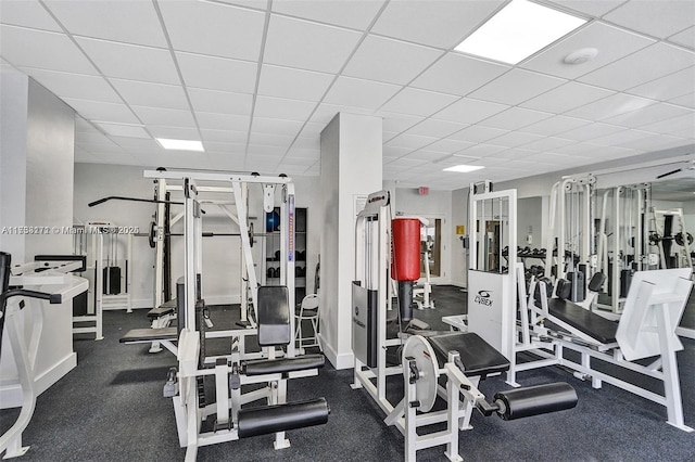 workout area featuring a drop ceiling