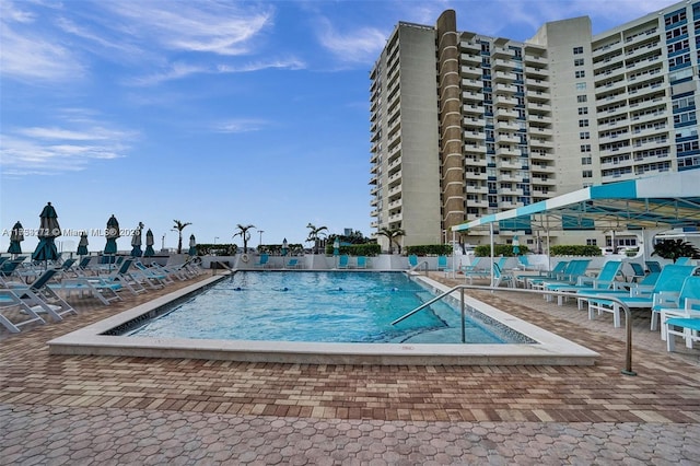 view of swimming pool with a patio area