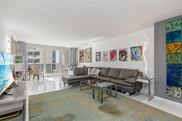 tiled living room with floor to ceiling windows