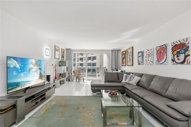 tiled living room with floor to ceiling windows