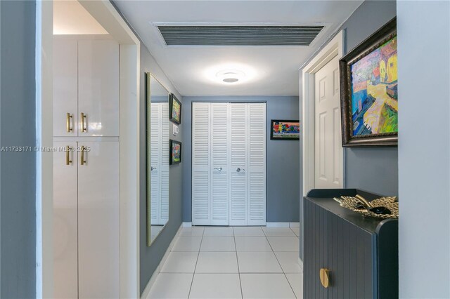 corridor featuring light tile patterned floors