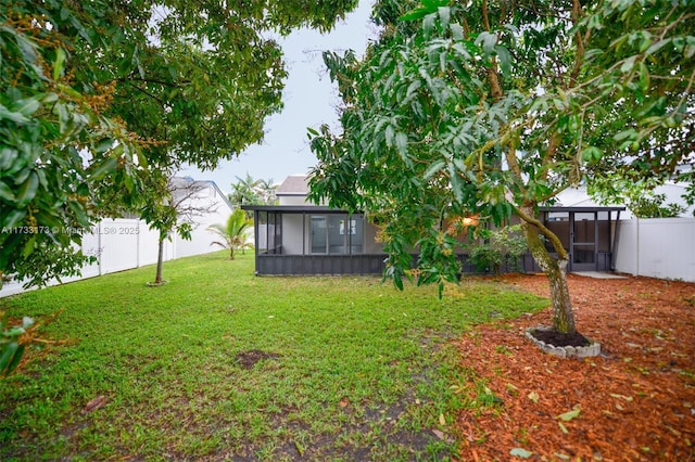 view of yard featuring a sunroom