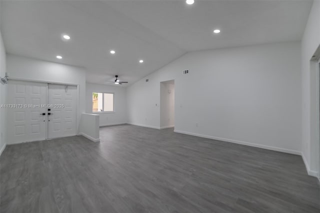 unfurnished room featuring ceiling fan, lofted ceiling, and dark hardwood / wood-style floors