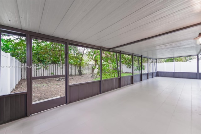 unfurnished sunroom featuring plenty of natural light