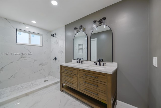 bathroom featuring vanity and tiled shower