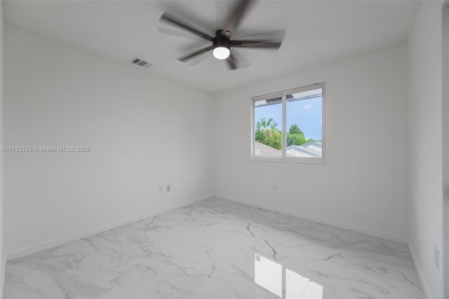 spare room with ceiling fan