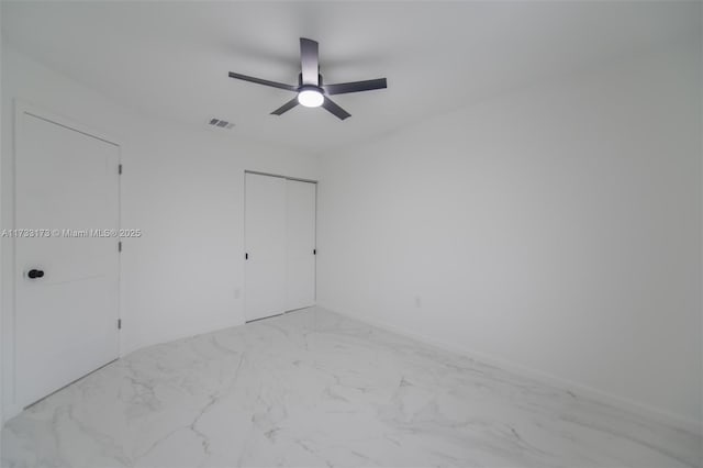 unfurnished room with ceiling fan