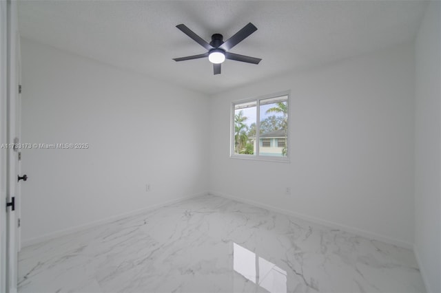 spare room featuring ceiling fan