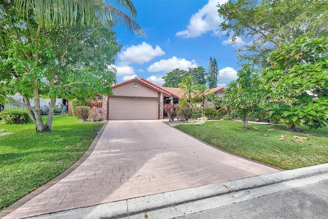 view of front of property with a garage and a front lawn