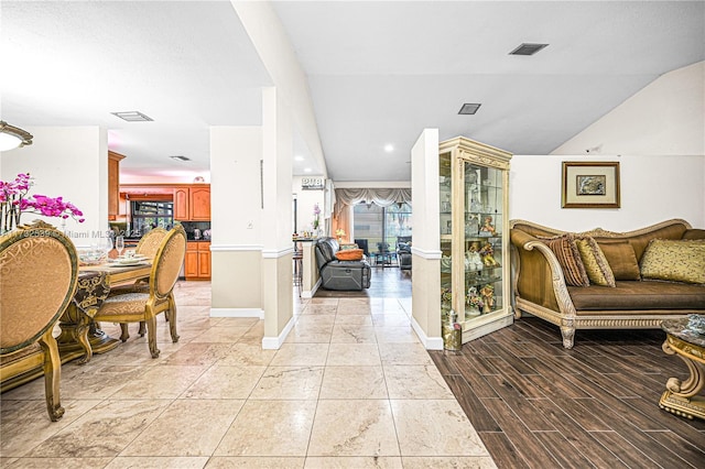 510 NW 105th Dr, Coral Springs, FL 33071 - foyer with light wood finished floors, baseboards, vaulted ceiling, and visible vents