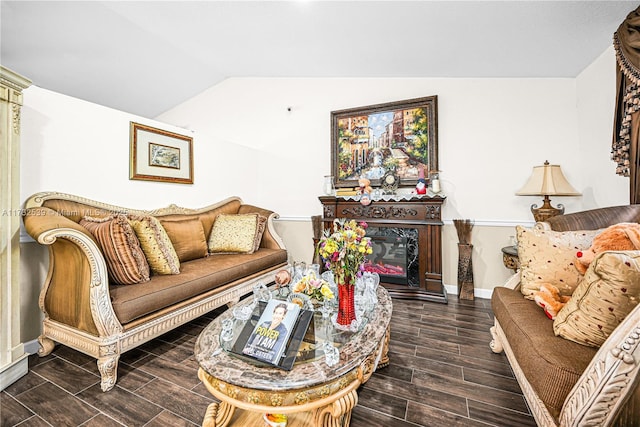 living room featuring vaulted ceiling