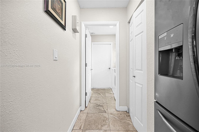 hallway with light tile patterned floors