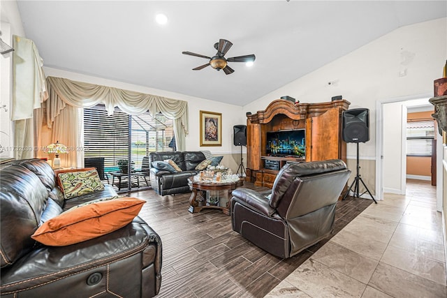 living room featuring vaulted ceiling and ceiling fan