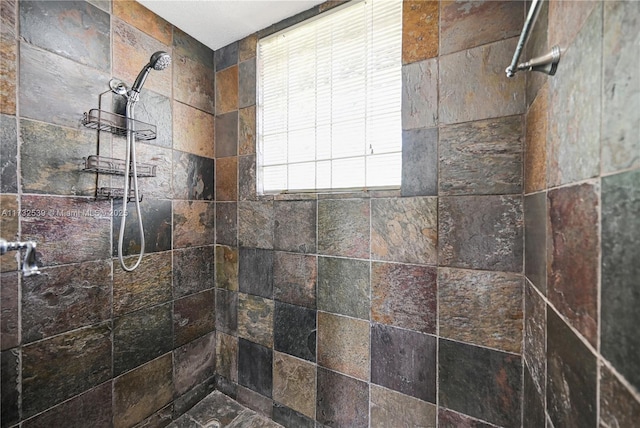 bathroom with a tile shower