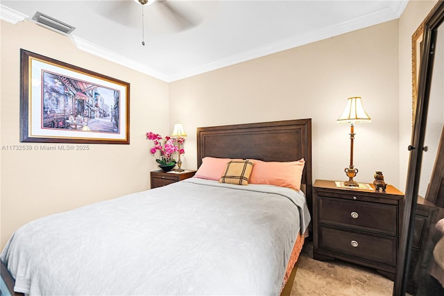 bedroom with ornamental molding and ceiling fan