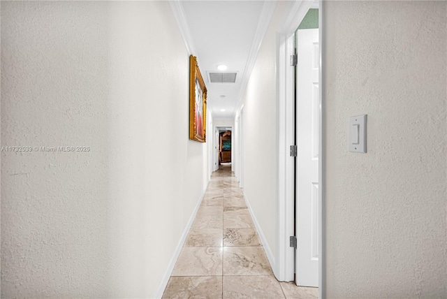 hallway featuring ornamental molding