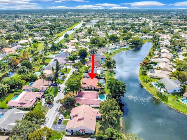 birds eye view of property featuring a water view